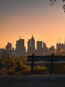 Preview wallpaper city, buildings, trees, bench, twilight