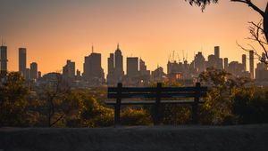 Preview wallpaper city, buildings, trees, bench, twilight