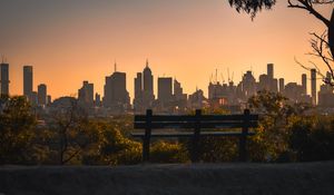 Preview wallpaper city, buildings, trees, bench, twilight