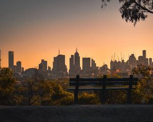 Preview wallpaper city, buildings, trees, bench, twilight