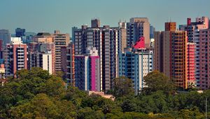 Preview wallpaper city, buildings, trees, aerial view, colorful