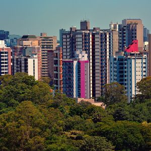 Preview wallpaper city, buildings, trees, aerial view, colorful