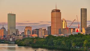 Preview wallpaper city, buildings, trees, water, twilight