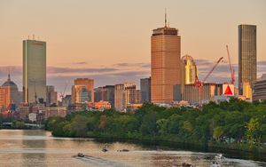 Preview wallpaper city, buildings, trees, water, twilight