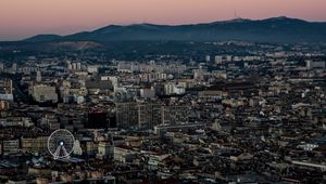 Preview wallpaper city, buildings, valley, mountains, dusk