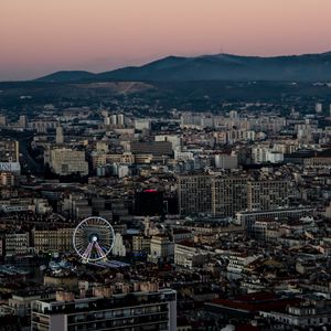 Preview wallpaper city, buildings, valley, mountains, dusk