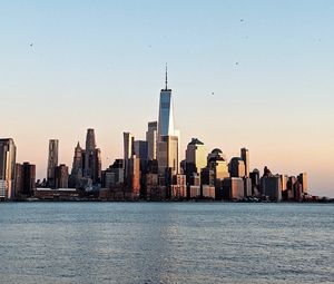 Preview wallpaper city, buildings, water, birds