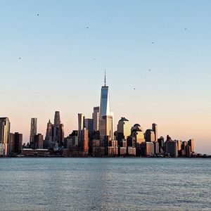 Preview wallpaper city, buildings, water, birds