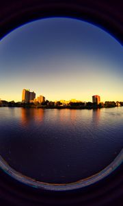 Preview wallpaper city, buildings, water, porthole, view