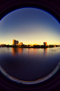 Preview wallpaper city, buildings, water, porthole, view
