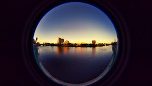 Preview wallpaper city, buildings, water, porthole, view