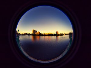 Preview wallpaper city, buildings, water, porthole, view