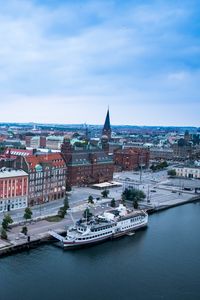 Preview wallpaper city, buildings, water, boat, aerial view