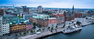 Preview wallpaper city, buildings, water, boat, aerial view