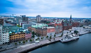 Preview wallpaper city, buildings, water, boat, aerial view