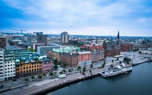 Preview wallpaper city, buildings, water, boat, aerial view