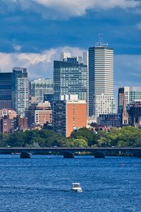 Preview wallpaper city, buildings, water, boat