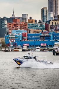 Preview wallpaper city, buildings, water, boat, pier