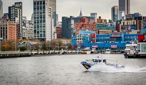 Preview wallpaper city, buildings, water, boat, pier