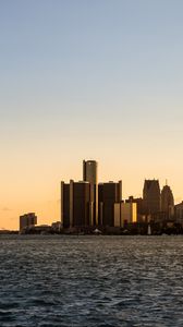 Preview wallpaper city, buildings, water, sky, twilight