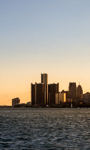 Preview wallpaper city, buildings, water, sky, twilight