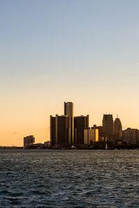 Preview wallpaper city, buildings, water, sky, twilight