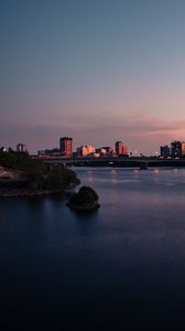 Preview wallpaper city, buildings, water, twilight, sunset