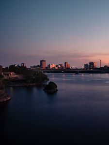Preview wallpaper city, buildings, water, twilight, sunset