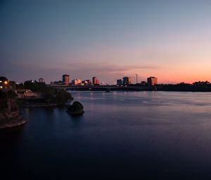 Preview wallpaper city, buildings, water, twilight, sunset