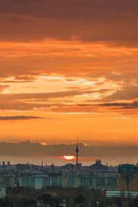 Preview wallpaper city, cityscape, buildings, sun, sunset