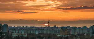 Preview wallpaper city, cityscape, buildings, sun, sunset