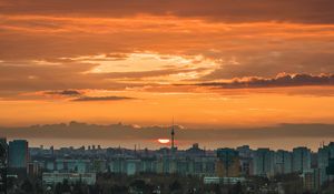 Preview wallpaper city, cityscape, buildings, sun, sunset