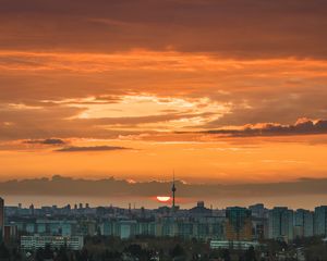 Preview wallpaper city, cityscape, buildings, sun, sunset