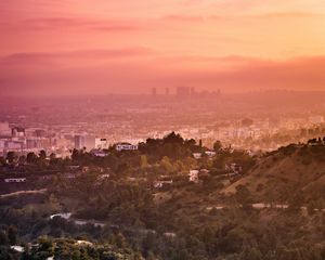 Preview wallpaper city, cityscape, hills, road, twilight