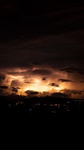 Preview wallpaper city, clouds, glow, night, dark