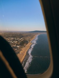 Preview wallpaper city, coast, aerial view, porthole, airplane