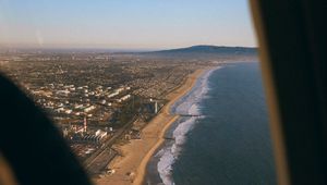 Preview wallpaper city, coast, aerial view, porthole, airplane