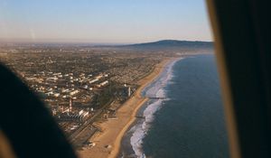 Preview wallpaper city, coast, aerial view, porthole, airplane