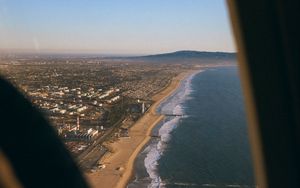 Preview wallpaper city, coast, aerial view, porthole, airplane