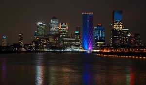 Preview wallpaper city, coast, buildings, night, lights, water, reflection