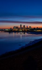 Preview wallpaper city, coast, buildings, water, reflection, night