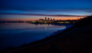 Preview wallpaper city, coast, buildings, water, reflection, night