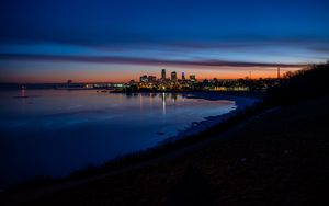 Preview wallpaper city, coast, buildings, water, reflection, night