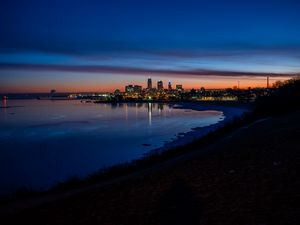 Preview wallpaper city, coast, buildings, water, reflection, night