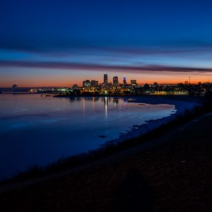 Preview wallpaper city, coast, buildings, water, reflection, night