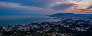 Preview wallpaper city, coast, sea, stones, evening