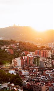 Preview wallpaper city, dawn, aerial view, sunlight, buildings