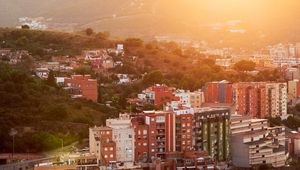 Preview wallpaper city, dawn, aerial view, sunlight, buildings