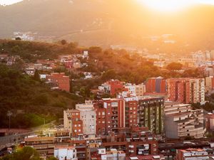 Preview wallpaper city, dawn, aerial view, sunlight, buildings