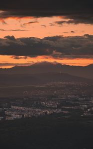 Preview wallpaper city, evening, mountains, sunset